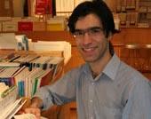 A staff member with boxes of music books